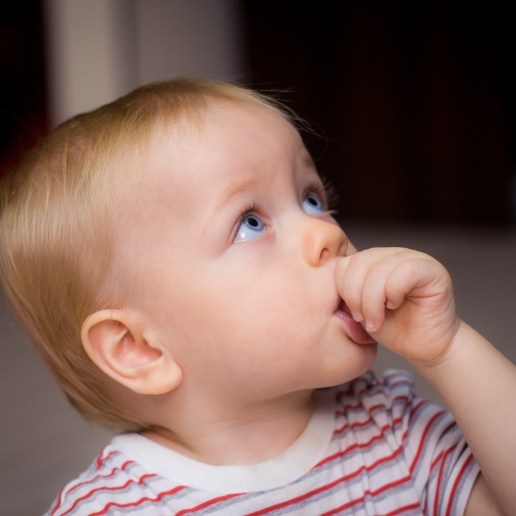 Baby sucking their thumb