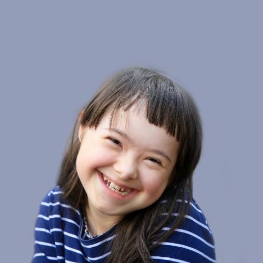Smiling young girl with special needs