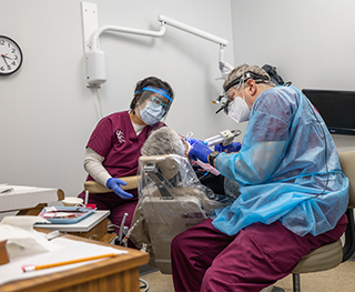 Chicago dentist and dental team member treating a patient