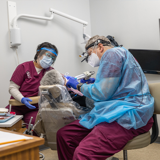 Chicago dentist and dental team member treating a patient