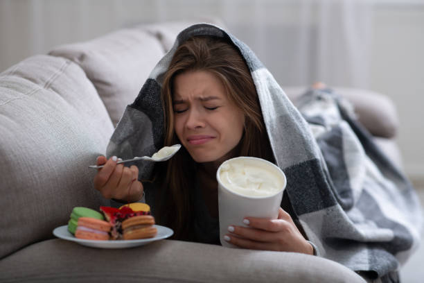 person consuming large amounts of sweets