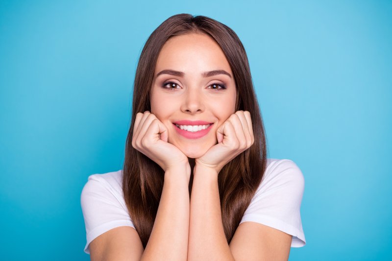 A woman smiling after her cosmetic dentistry treatment