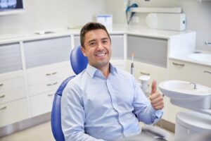 Man smiling after his urgent dental visit
